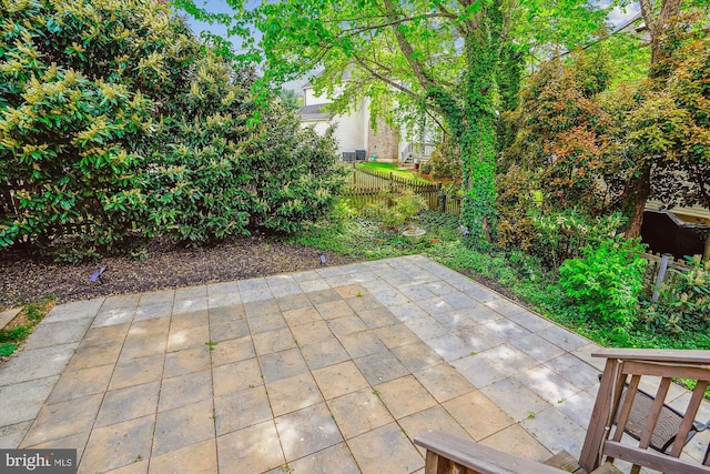 view of patio / terrace featuring fence