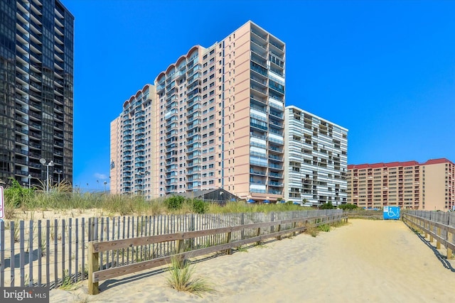 view of building exterior with fence