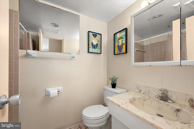 bathroom with visible vents, toilet, vanity, and a shower with curtain