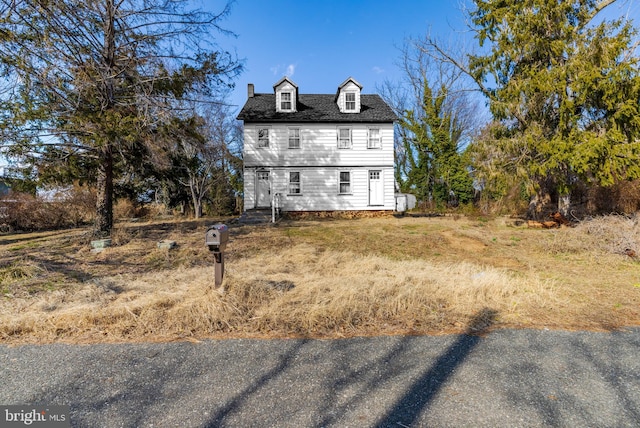 view of front of house featuring roof with shingles