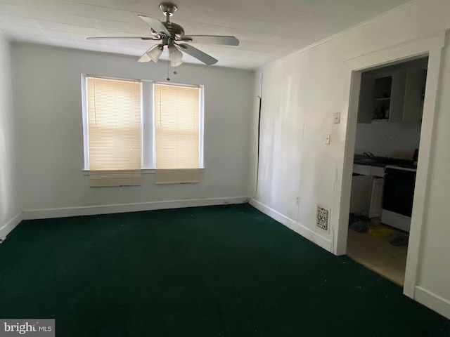 unfurnished room with visible vents, ceiling fan, and baseboards