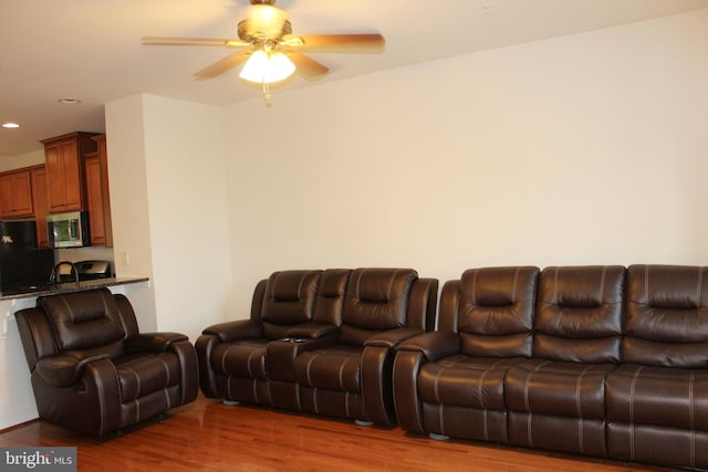 living room featuring recessed lighting, wood finished floors, and a ceiling fan