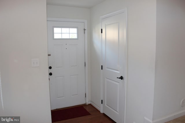 entryway with wood finished floors