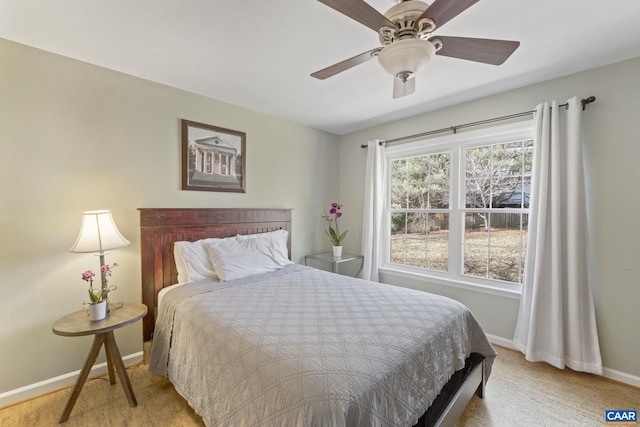 bedroom featuring carpet flooring, a ceiling fan, and baseboards