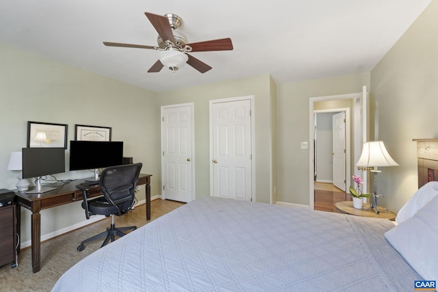 bedroom with baseboards and ceiling fan