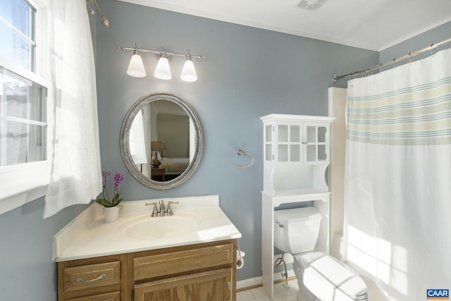 bathroom featuring crown molding, baseboards, shower / bath combo with shower curtain, toilet, and vanity