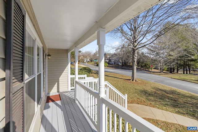 wooden terrace featuring a porch