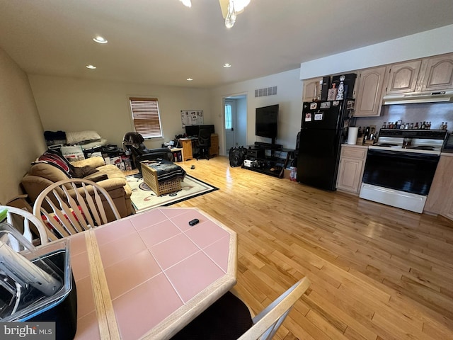 dining area with recessed lighting, visible vents, and light wood-style flooring