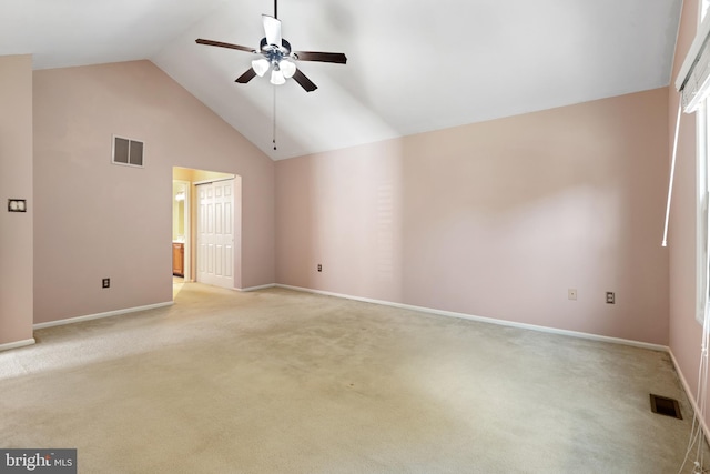 unfurnished room with visible vents, light carpet, high vaulted ceiling, and ceiling fan