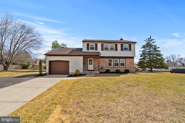 colonial home featuring brick siding, driveway, an attached garage, and a front lawn