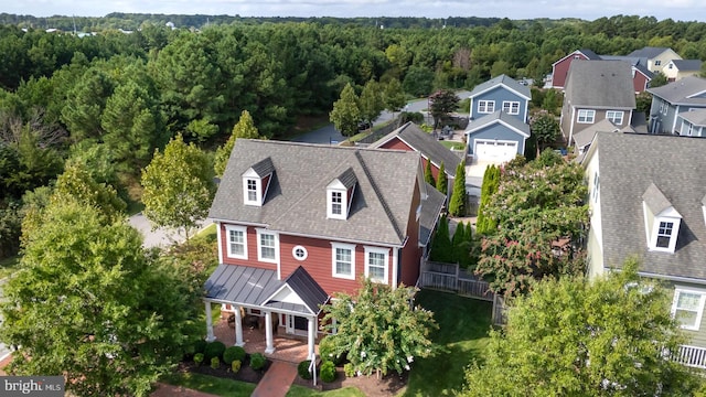 bird's eye view with a forest view and a residential view