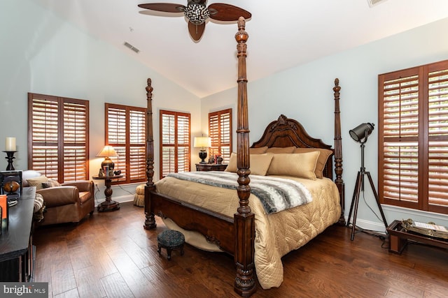 bedroom with baseboards, vaulted ceiling, and hardwood / wood-style flooring