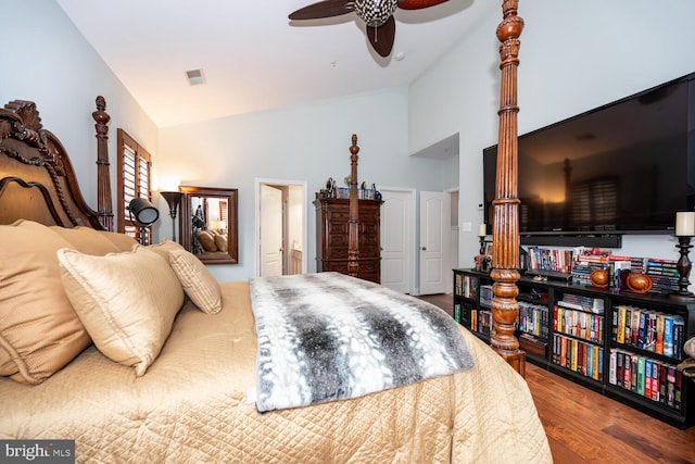 bedroom with high vaulted ceiling, wood finished floors, visible vents, and ceiling fan