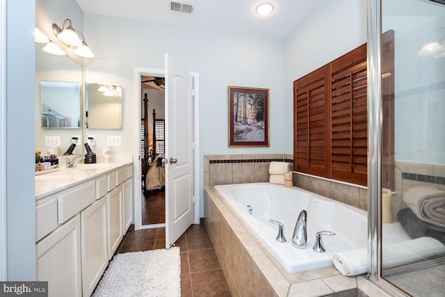 bathroom featuring visible vents, a shower stall, tile patterned floors, a bath, and vanity