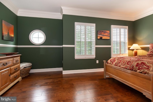 bedroom featuring baseboards, dark wood-type flooring, and ornamental molding