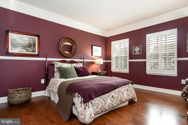 bedroom featuring wood finished floors, baseboards, and ornamental molding