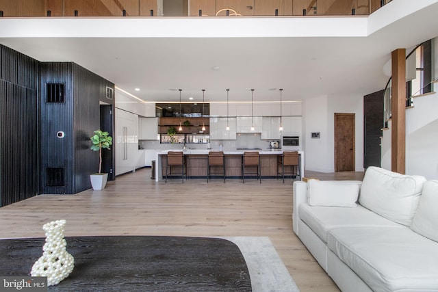 living area featuring recessed lighting and light wood-type flooring