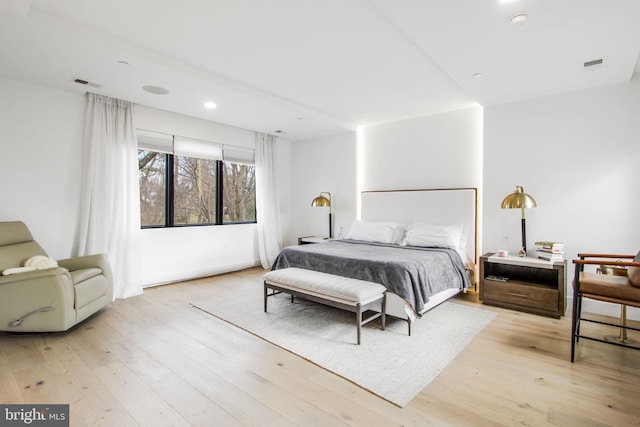 bedroom featuring recessed lighting, visible vents, and light wood-style flooring