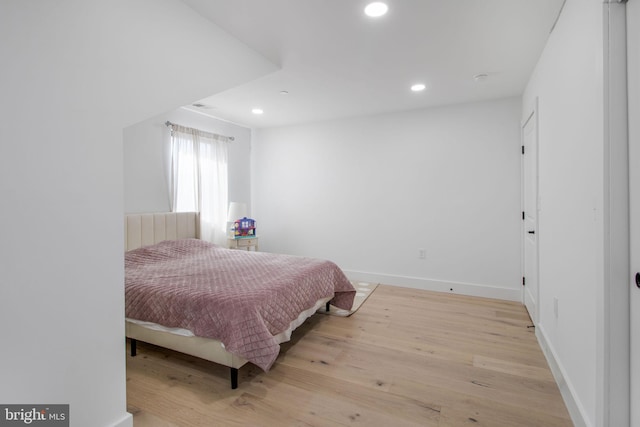 bedroom featuring recessed lighting, baseboards, and light wood finished floors