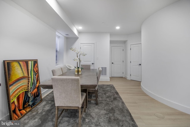 dining space with visible vents, recessed lighting, light wood-type flooring, and baseboards