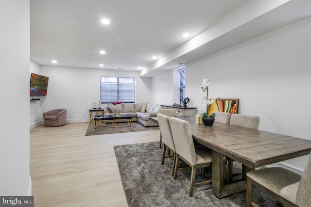 dining space with light wood-style flooring, recessed lighting, and baseboards