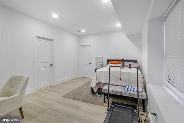 bedroom featuring recessed lighting, light wood-type flooring, and baseboards