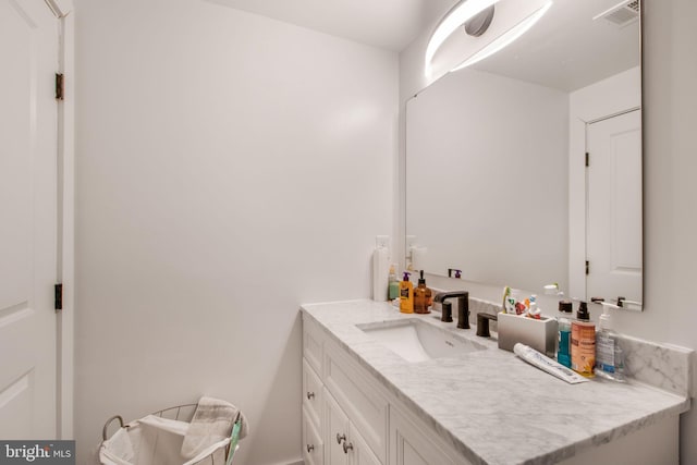 bathroom featuring vanity and visible vents