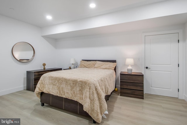 bedroom with recessed lighting, light wood-type flooring, and baseboards