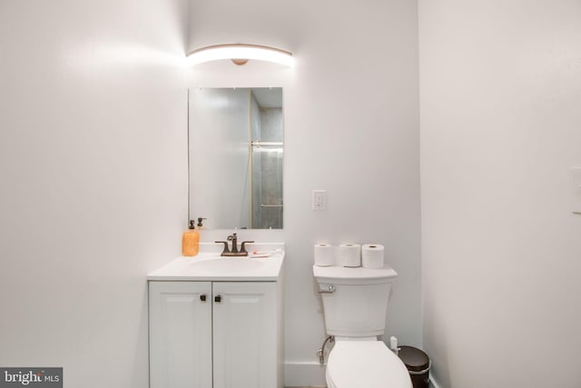 bathroom featuring toilet and vanity