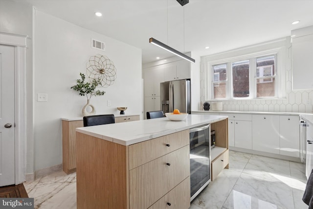 kitchen with wine cooler, marble finish floor, modern cabinets, and stainless steel fridge with ice dispenser