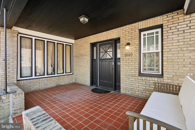 entrance to property with brick siding