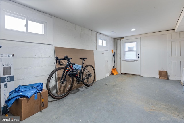 garage with concrete block wall