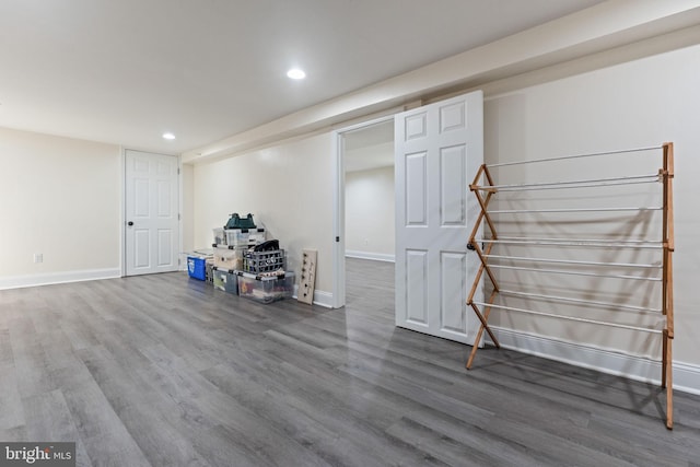 finished basement featuring recessed lighting, baseboards, and wood finished floors