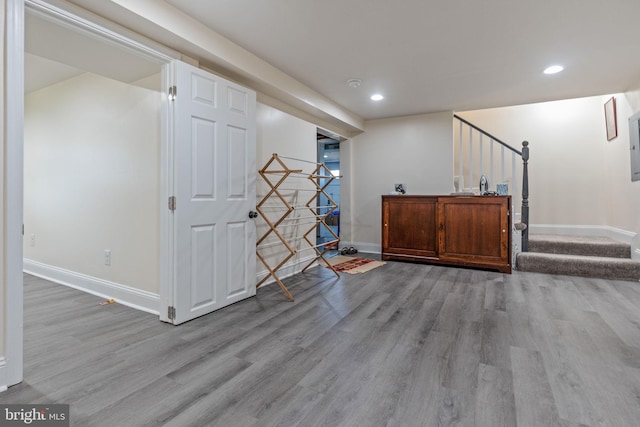 basement with recessed lighting, baseboards, and wood finished floors