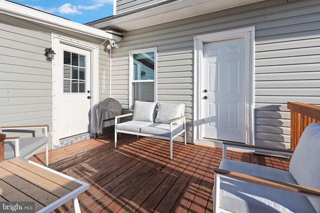 wooden deck with outdoor lounge area