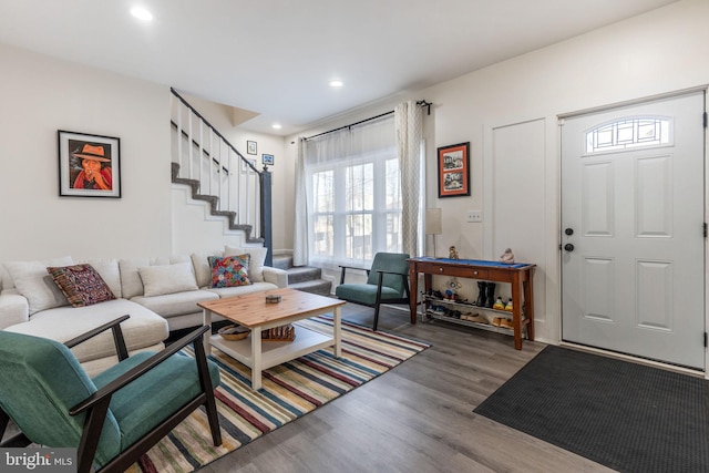 living room with stairway, recessed lighting, and wood finished floors