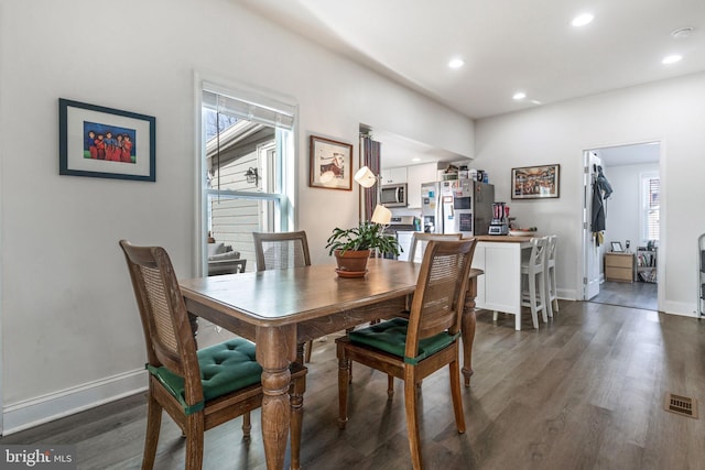 dining room with visible vents, recessed lighting, baseboards, and dark wood-style flooring