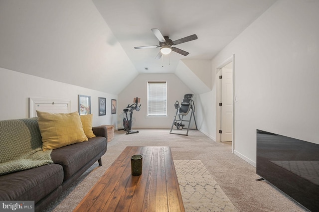 interior space featuring baseboards, light carpet, lofted ceiling, and ceiling fan