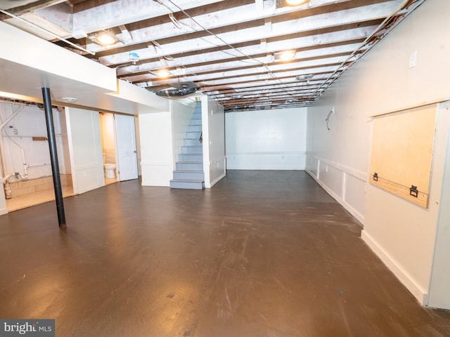 finished basement featuring stairs