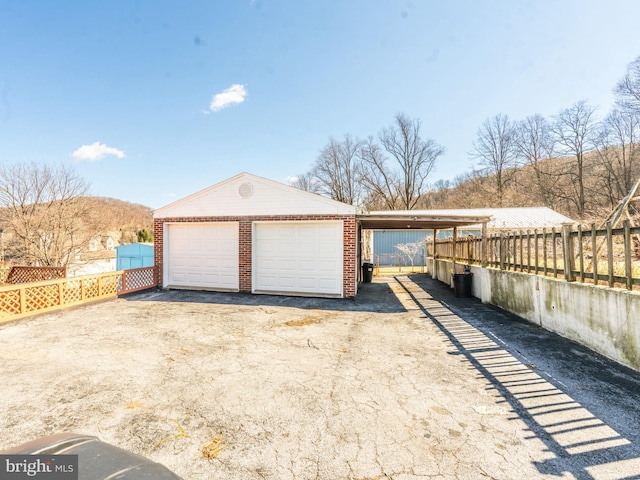 garage with a garage and fence