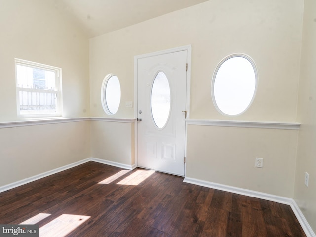 entrance foyer featuring baseboards and wood finished floors