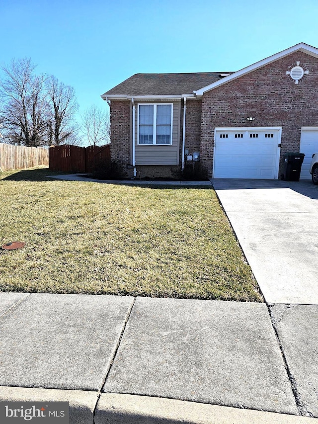 ranch-style house with fence, concrete driveway, a front yard, a garage, and brick siding