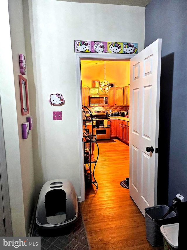 hallway featuring light wood-style flooring