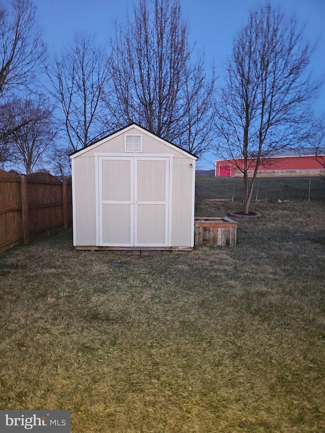 view of shed with a fenced backyard