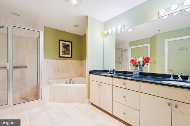1400 Lancaster St Unit 605, Baltimore, MD 21231 - full bathroom featuring double vanity, a bath, a stall shower, and a sink