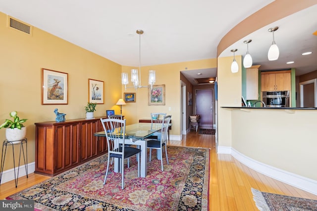 1400 Lancaster St Unit 605, Baltimore, MD 21231 - dining area with light wood-style floors, visible vents, and baseboards