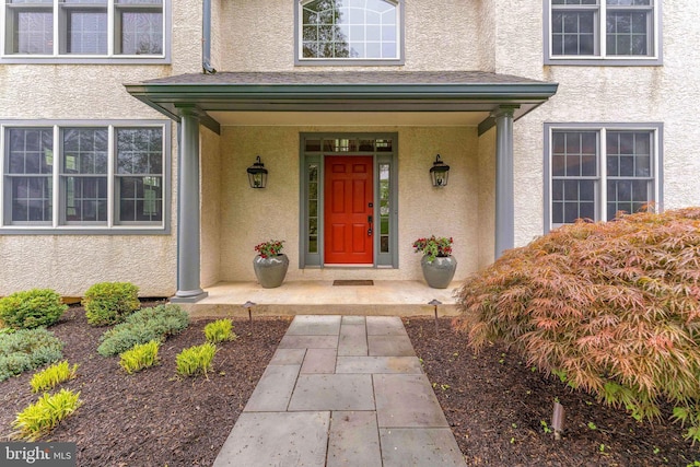 1052 Cedar Mill Ln, West Chester, PA 19382 - doorway to property with stucco siding and a porch