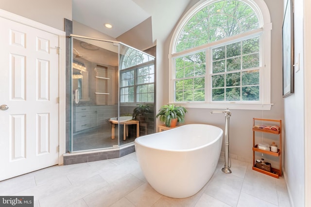 1052 Cedar Mill Ln, West Chester, PA 19382 - bathroom with a stall shower, a freestanding tub, tile patterned floors, baseboards, and lofted ceiling