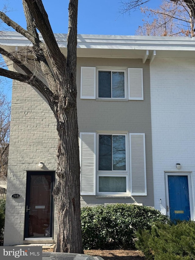 entrance to property with brick siding