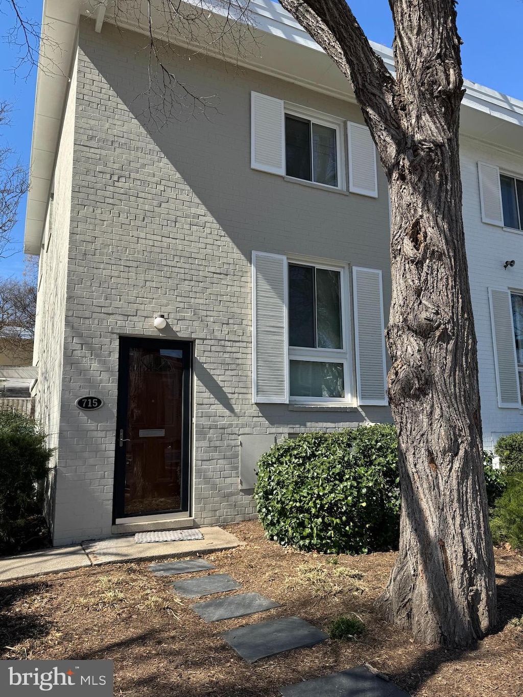 exterior space featuring brick siding